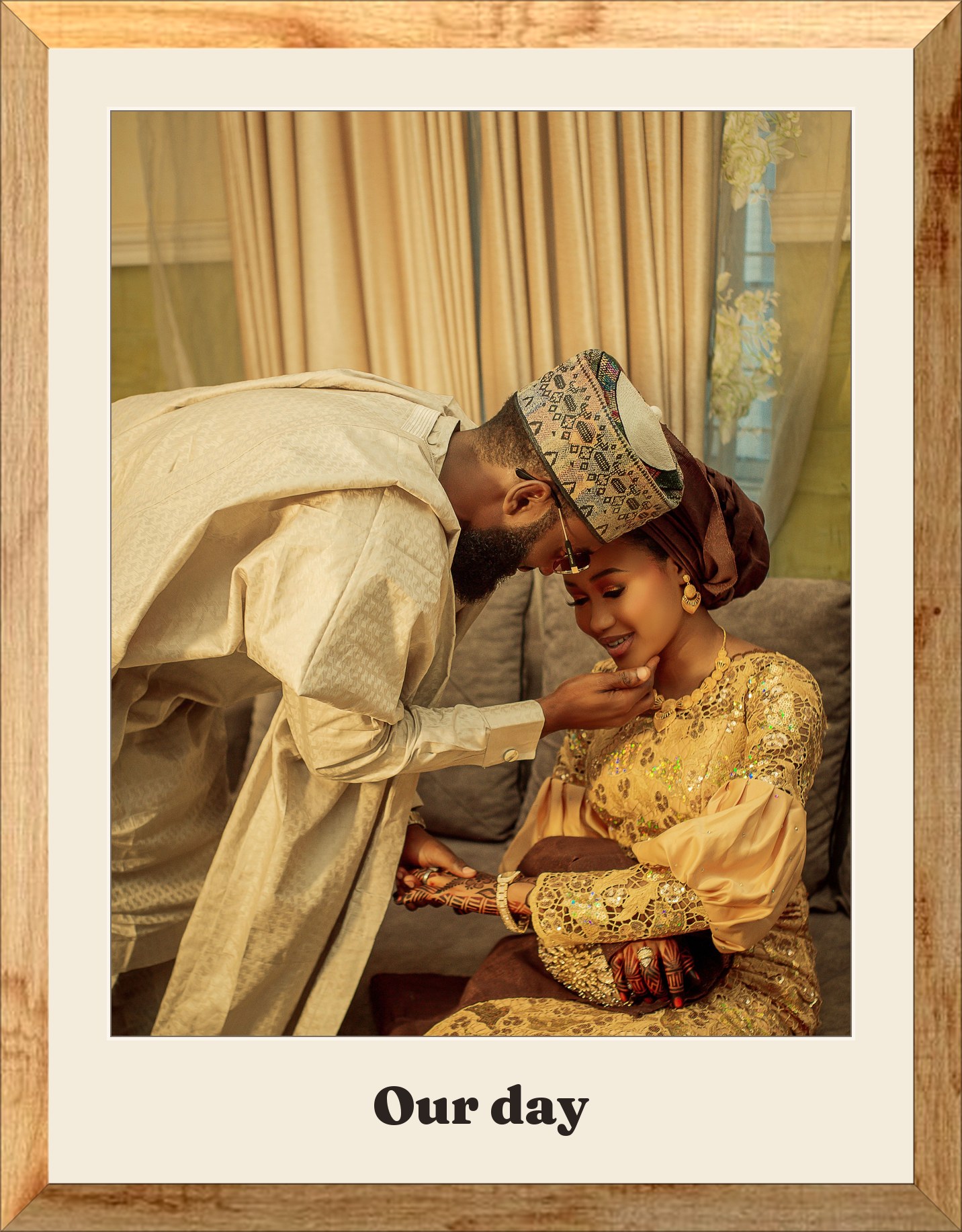 A couple in traditional gold aso-oke, framed in oak